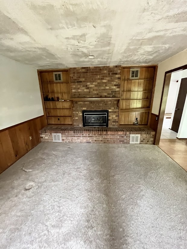 before brick fireplace living room with built in shelves in littleton whole home remodel