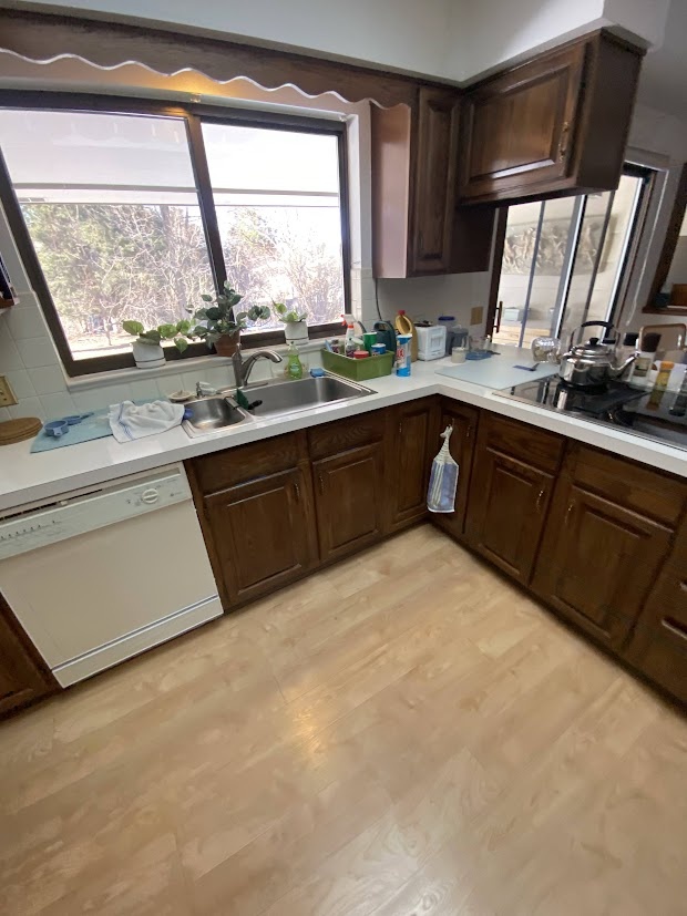before kitchen sink and dark wood cabinets in littleton whole home remodel