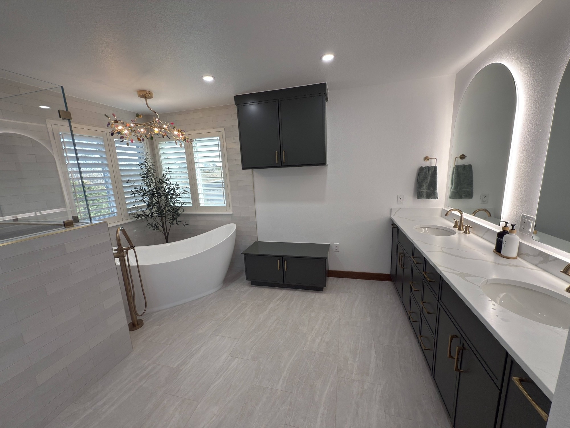 after littleton bathroom remodel spacious vanity area with soaking tub and dark cabinets