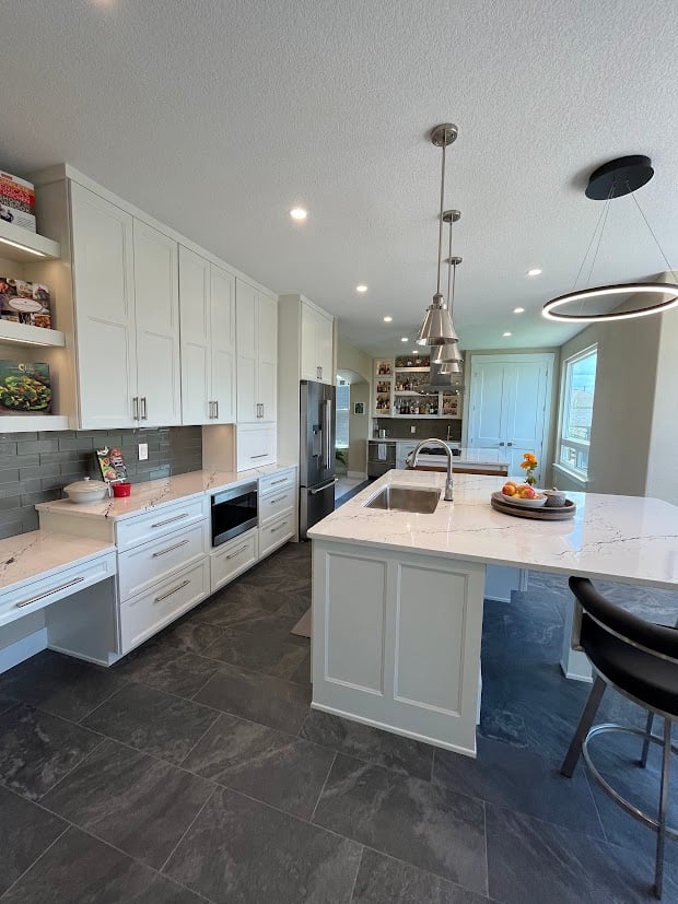 Seating under bar and custom cabinetry in kitchen remodel