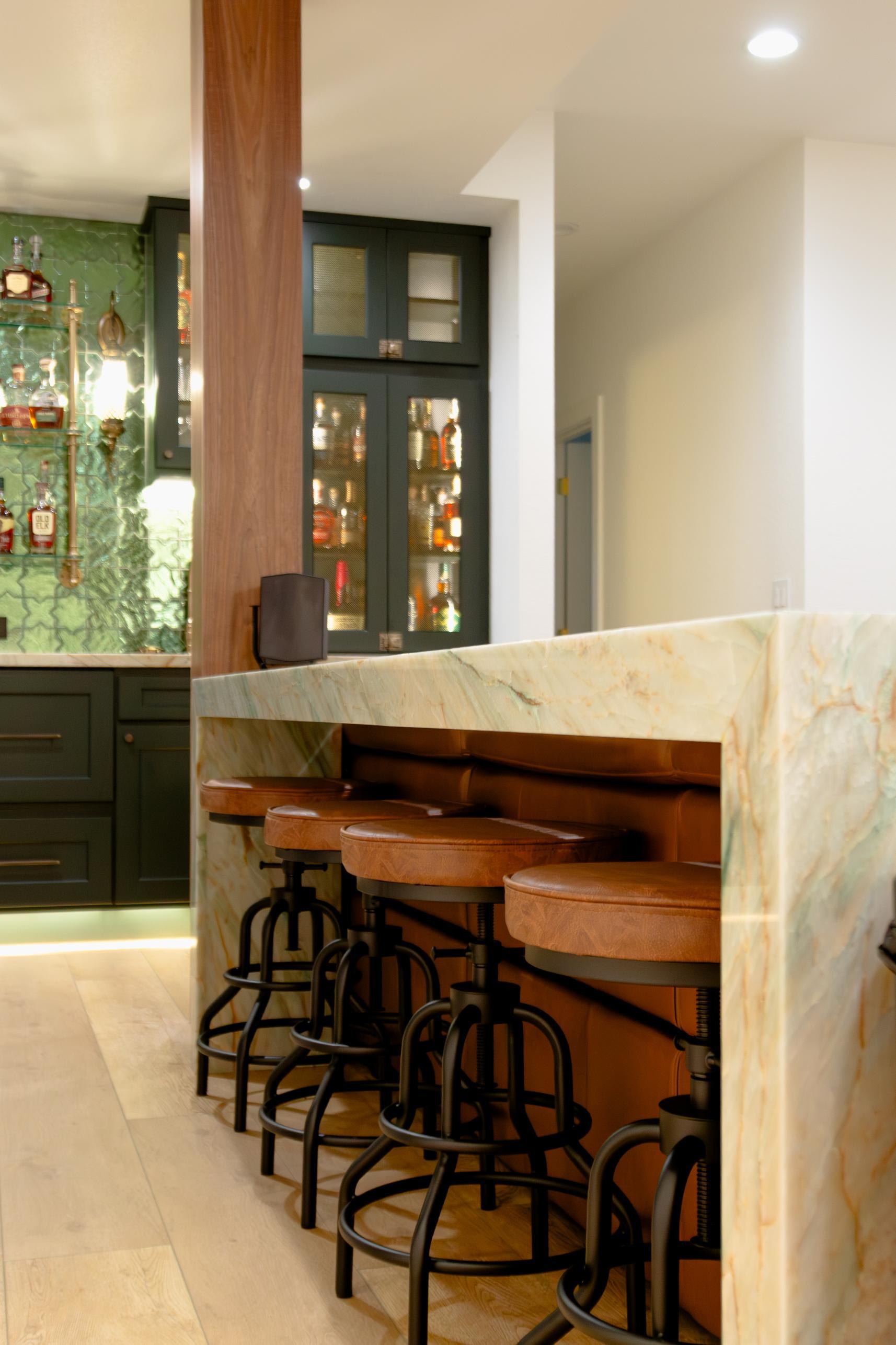 Built in seating bar in basement remodel in Denver by Grimes Home Concepts