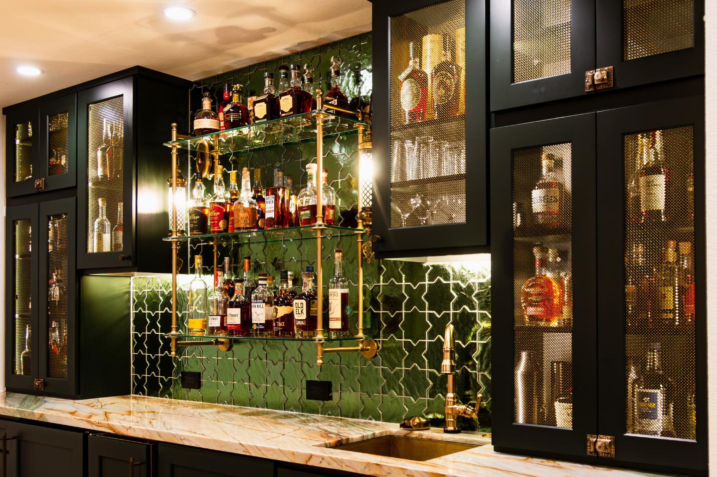 Corner view of black shelving and green tile in basement bar in remodel in Denver by Grimes Home Concepts