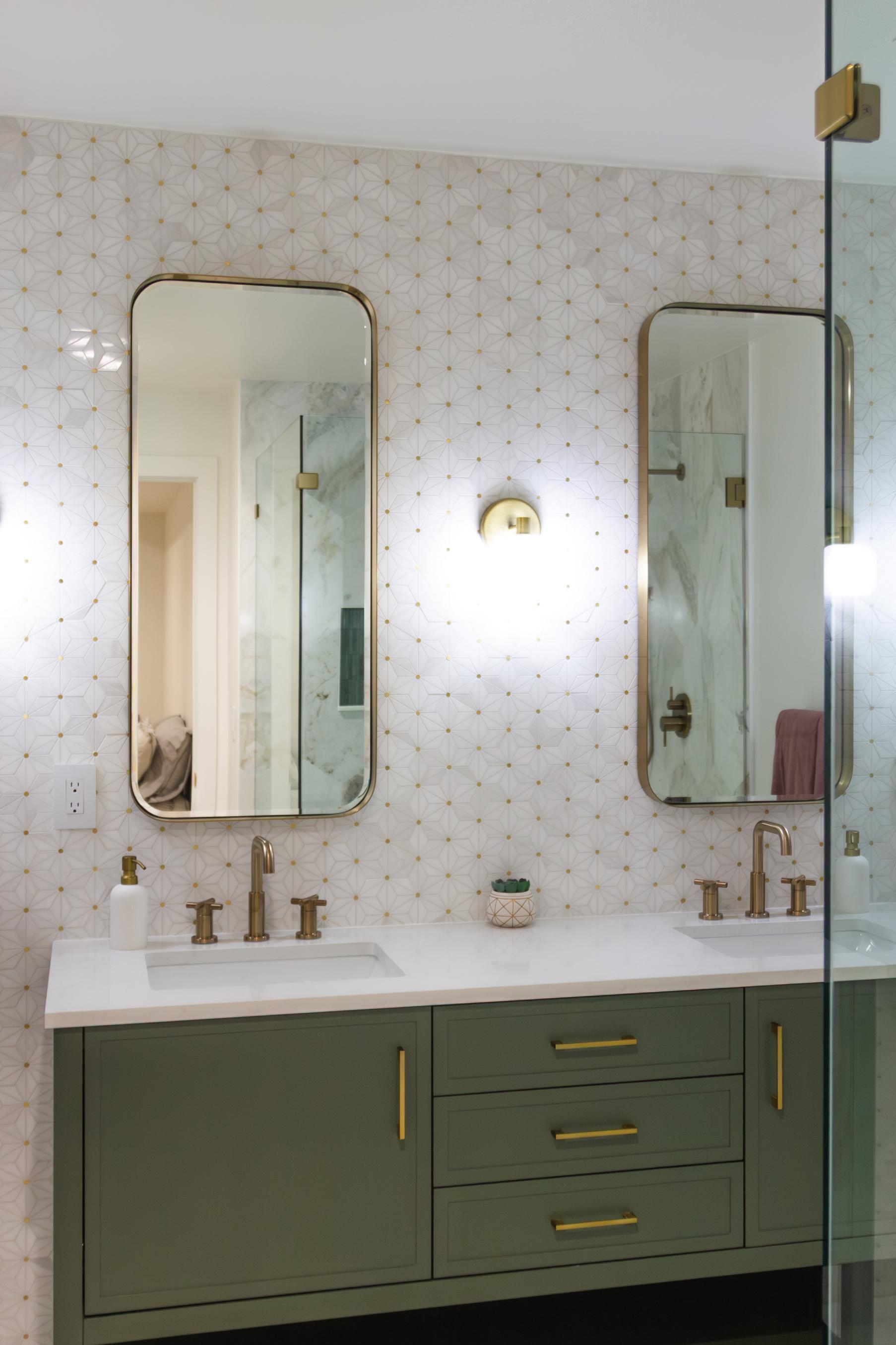 Green custom vanity in mid-century modern bathroom in basement remodel in Denver by Grimes Home Concepts