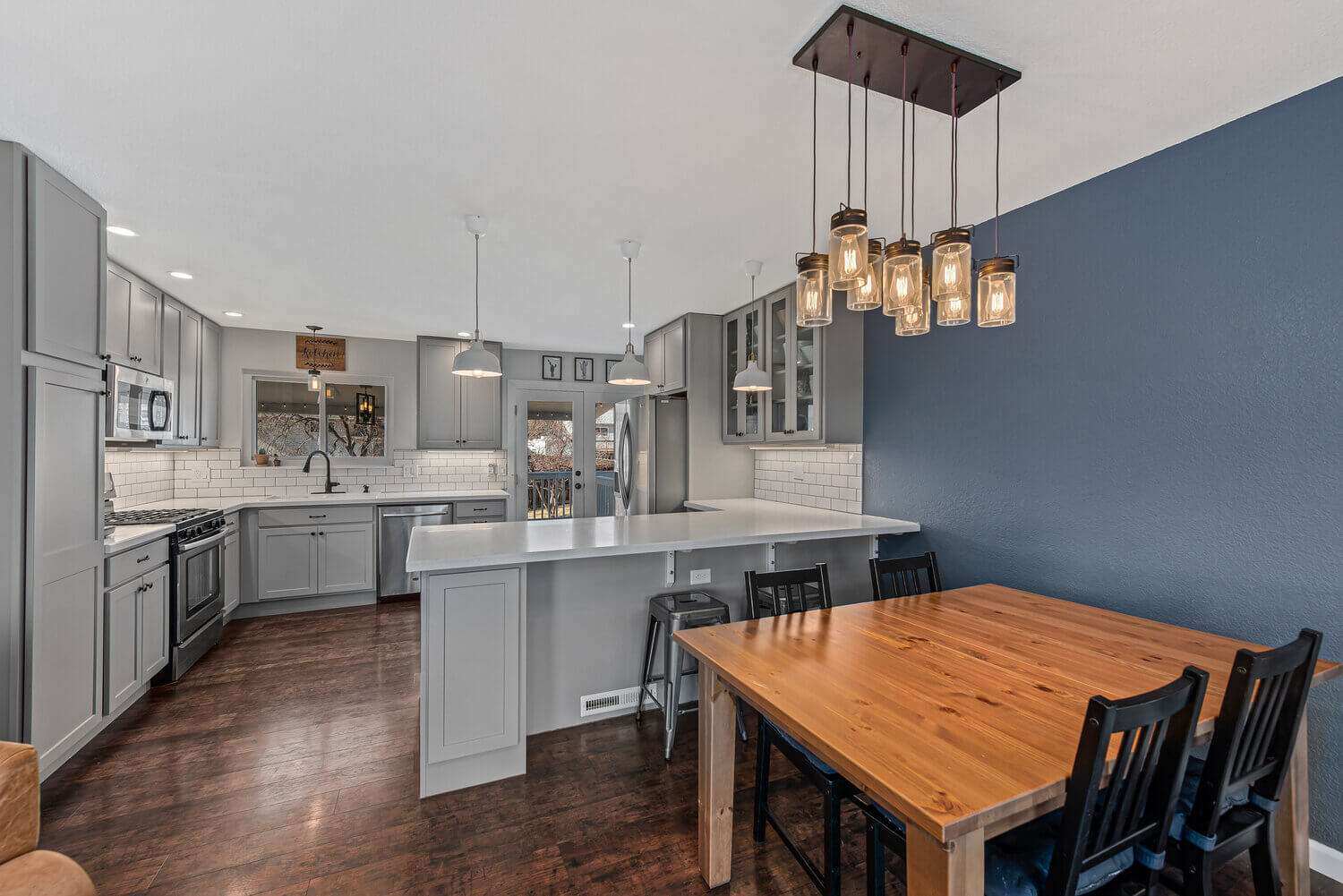 Open-concept-kitchen-grey-cabinets-hardwood-floors-navy-blue-wall-Littleton-Colorado5 Open-concept-kitchen-grey-cabinets-hardwood-floors-navy-blue-wall-Littleton-Colorado5
